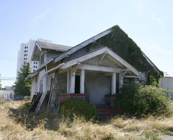 A sore sight for anyone's eyes, this 1916 Craftsman bungalow in Tacoma's Hilltop neighborhood is slated for demolition. Despite few incentives to recycle and reuse the building's materials, the owner-developer and a preservationist have collaborated to make sure some of the materials are recycled instead of sent to a landfill. (PHOTO BY TODD MATTHEWS)