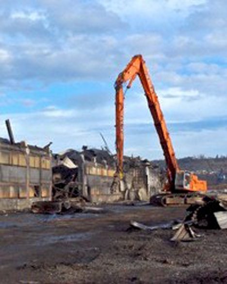 Building #65 at the former Kaiser Aluminum Smelter site was recently demolished as part of a project at the Port of Tacoma aimed to redevelop the 96-acre site. Port officials said this week that they were able to recycle more than 150 million pounds of steel, copper, aluminum, lead, concrete, alumina ore, oil and carbon anodes. (PHOTO BY CHRIS MILEWSKI / COURTESY PORT OF TACOMA, SHAW ENVIORNMENTAL)