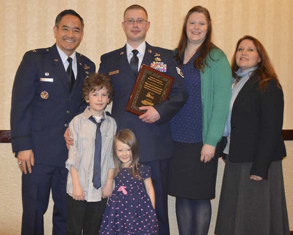 Colonel David Kumashiro (far left) and America’s Credit Union’s Military Relations Liaison (far right) presented the Tacoma-Pierce County Chamber's 35th Annual John H. Anderson Military Citizen of the Year Award to Staff Sergeant Jason Truskowski (center) on Wednesday. Truskowski was joined by his wife Kristin and their children. (PHOTO COURTESY TACOMA-PIERCE COUNTY CHAMBER)