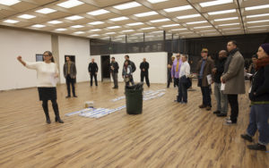 Spaceworks Tacoma Manager Heather Joy leads prospective tenants on a tour of 1120 Spaceworks, a new creative co-working space that will open in a commercial office building in downtown Tacoma. "The building is such a great opportunity for Spaceworks Tacoma because it's right downtown, it's so visible, and it's been vacant for so long," said Joy. "People are excited to hear Spaceworks is doing something like this." (PHOTO BY KRIS CREWS / COURTESY SPACEWORKS TACOMA)