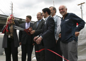 Pierce County Executive Pat McCarthy, City of Tacoma Environmental Services Manager Mike Slevin, Pierce County Councilmember Rick Talbert, Pierce County Public Works Director Brian Ziegler, Tacoma City Councilmember Ryan Mello, and Puyallup Deputy Mayor John Hopkins attended a ribbon-cutting ceremony on Weds., June 3, to mark the completion of a major floodwall project at the City of Tacoma's Central Wastewater Treatment Plant. (PHOTO BY TODD MATTHEWS)