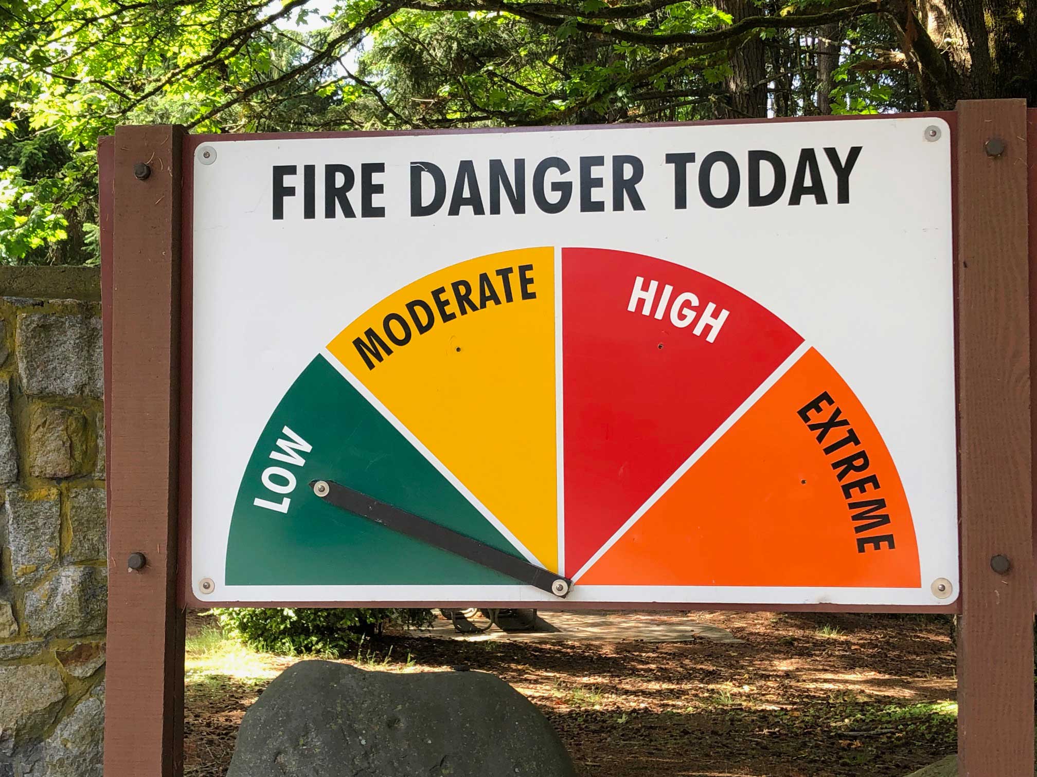 The fire hazard level swings as the summer heats up. This sign from Point Defiance shows a low level of danger, but the park has seen several devastating fires which have left charred marks on some of the older trees. Photo: Morf Morford