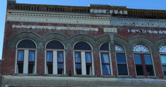 The idea of a state bank is not new. This 1889 Port Townsend building has “State Bank of Washington” engraved on its front. (Photo by Morf Morford)