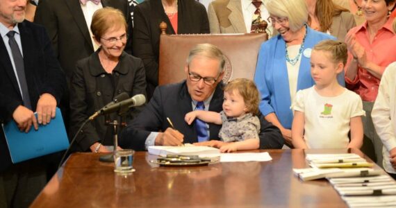 Office of the Governor
Gov. Jay Inslee signs legislation in 2017 creating the Department of Children, Youth and Families.