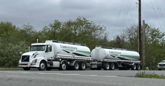 Bill Lucia/Washington State Standard
A Christensen fuel truck leaves a refinery in Anacortes. Christensen, a major agricultural fuel distributor, was among the first to offer exemptions under the Climate Commitment Act.