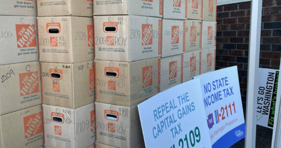 Jerry Cornfield/Washington State Standard
Let’s Go Washington, a political committee, faces allegations it did not properly disclose information on money raised and spent in its signature-gathering drives for six initiatives in 2023. These boxes contain signed petitions for one of them, Initiative 2109, which would to repeal Washington state’s capital gains tax. It will be on ballots in November 2024.