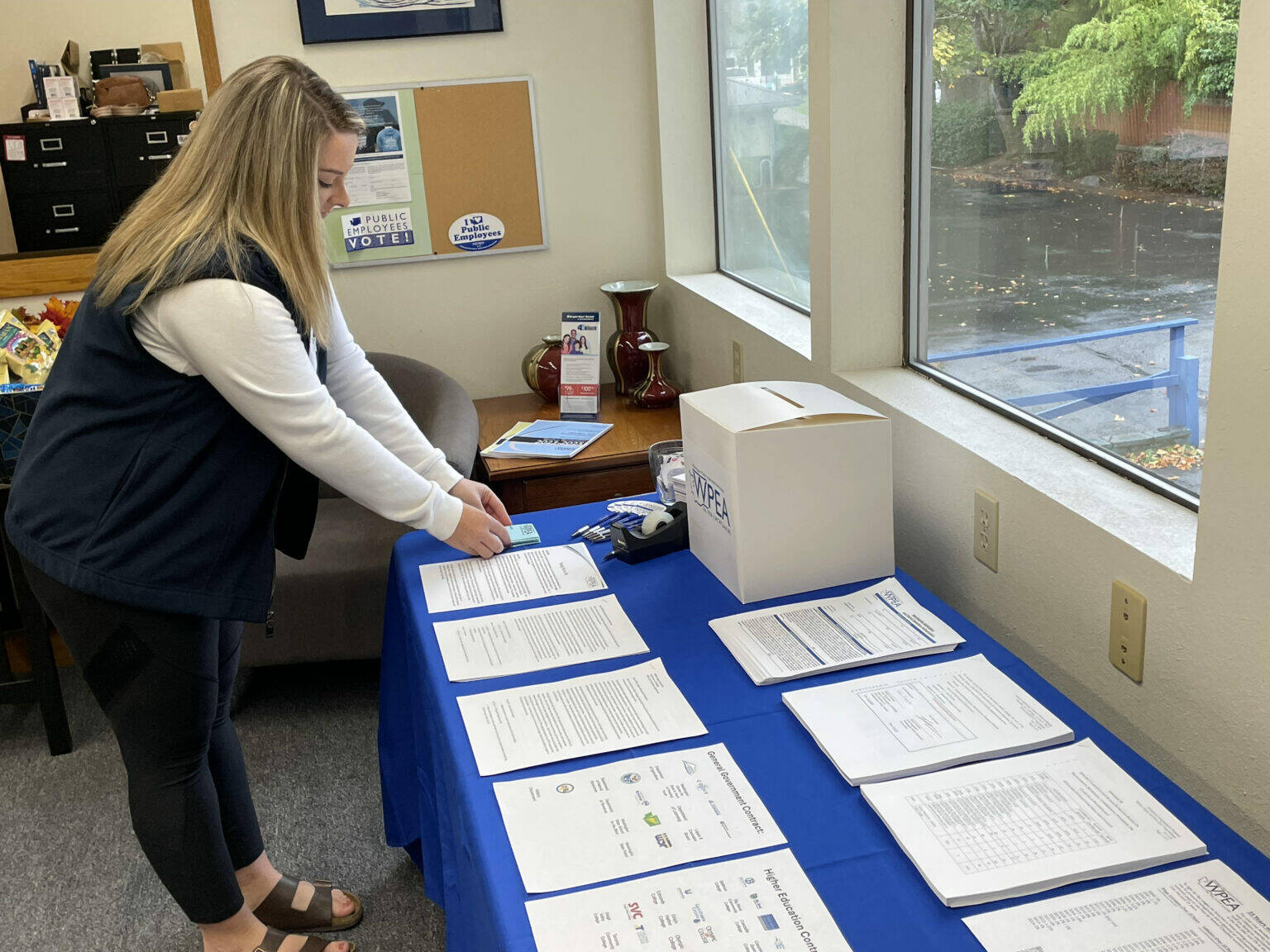 Jerry Cornfield/Washington State Standard
Members of the Washington Public Employees Association are voting on a new two-year contract this week that leaders of the union say they should reject. Aubrei Hansen, WPEA marketing and membership coordinator, is putting out ballots inside the Olympia office on Wednesday Sept. 25, 2024.