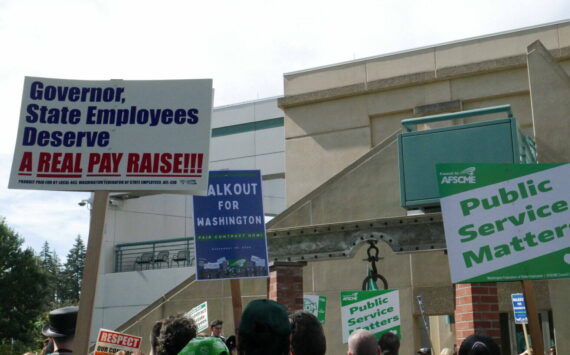 Laurel Demkovich/Washington State Standard
State employees gathered outside the Labor and Industries Building in Tumwater Sept. 10 as part of a statewide walkout to demand fair wages and safe staffing levels.