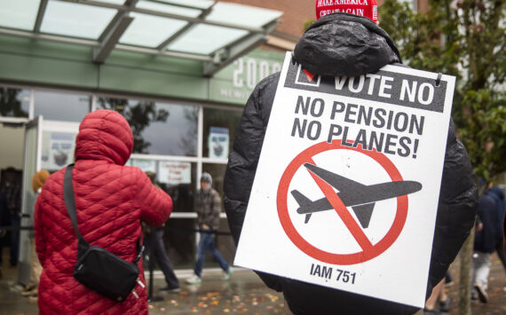 Olivia Vanni / Sound Publishing
Larry Best, a customer coordinator for quality assurance who has worked at Boeing for 38 years, stands outside of Angel of the Winds Arena with a “vote no” sign on Monday in Everett.