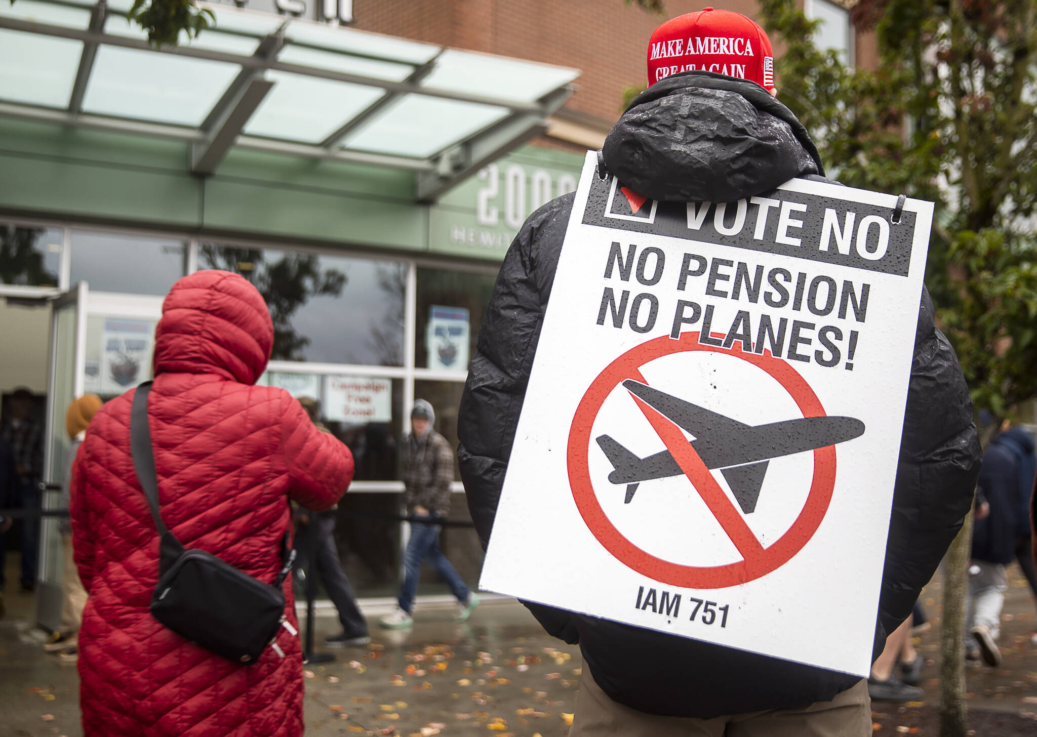 Olivia Vanni / Sound Publishing
Larry Best, a customer coordinator for quality assurance who has worked at Boeing for 38 years, stands outside of Angel of the Winds Arena with a “vote no” sign on Monday in Everett.