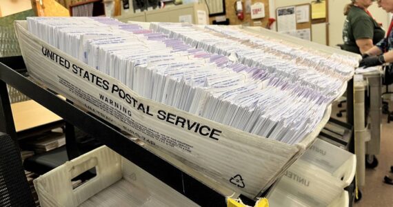 Ballot envelopes sit in the Thurston County elections center. (Laurel Demkovich/Washington State Standard)