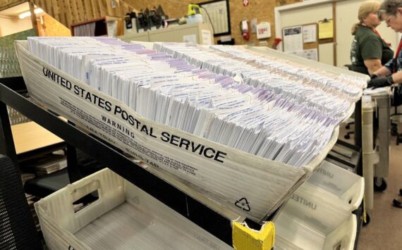 Ballot envelopes sit in the Thurston County elections center. (Laurel Demkovich/Washington State Standard)