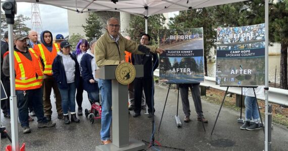 Gov. Jay Inslee released his 2024 budget proposals surrounding housing and homelessness programs at the site of a former encampment in Seattle last December. (Laurel Demkovich/Washington State Standard)