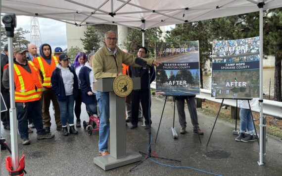 Gov. Jay Inslee released his 2024 budget proposals surrounding housing and homelessness programs at the site of a former encampment in Seattle last December. (Laurel Demkovich/Washington State Standard)