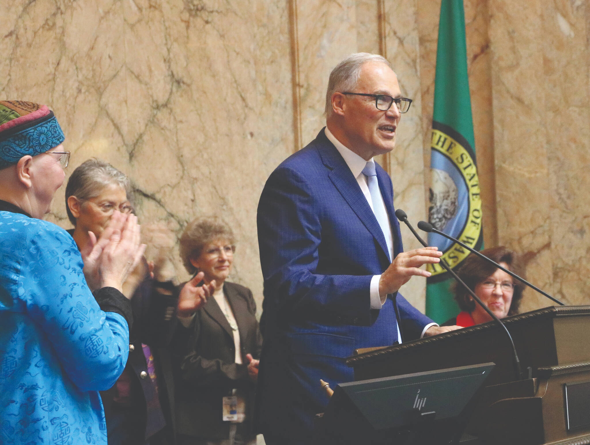 Entering his final year in office, Gov. Jay Inslee called for action on several fronts in his annual State of the State address to a joint session of the state Legislature. Photo by Aspen Anderson, WNPA Foundation