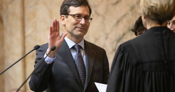 Bob Ferguson is sworn in as the 24th Governor of the State of Washington during his inauguration ceremony Wednesday, Jan. 15, 2025, at the Washington State Capitol in Olympia, Wash. (Ryan Berry/Washington State Standard)