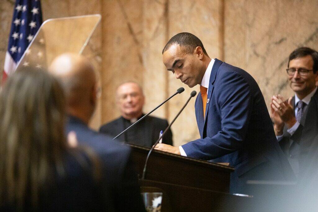 Attorney General Nick Brown signs his election certificate after being sworn in Wednesday, Jan. 15, 2025, at the Washington State Capitol in Olympia, Wash. (Ryan Berry/Washington State Standard)