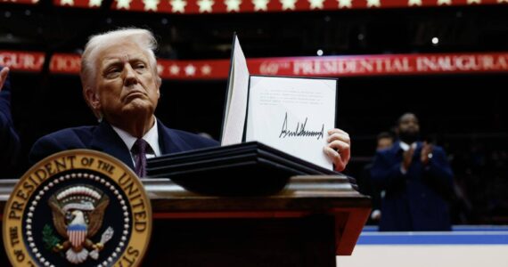 President Donald Trump holds up an executive order after signing it during an indoor inauguration parade at Capital One Arena on Jan. 20, 2025, in Washington, D.C. (Photo by Anna Moneymaker/Getty Images)