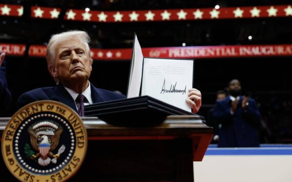 President Donald Trump holds up an executive order after signing it during an indoor inauguration parade at Capital One Arena on Jan. 20, 2025, in Washington, D.C. (Photo by Anna Moneymaker/Getty Images)