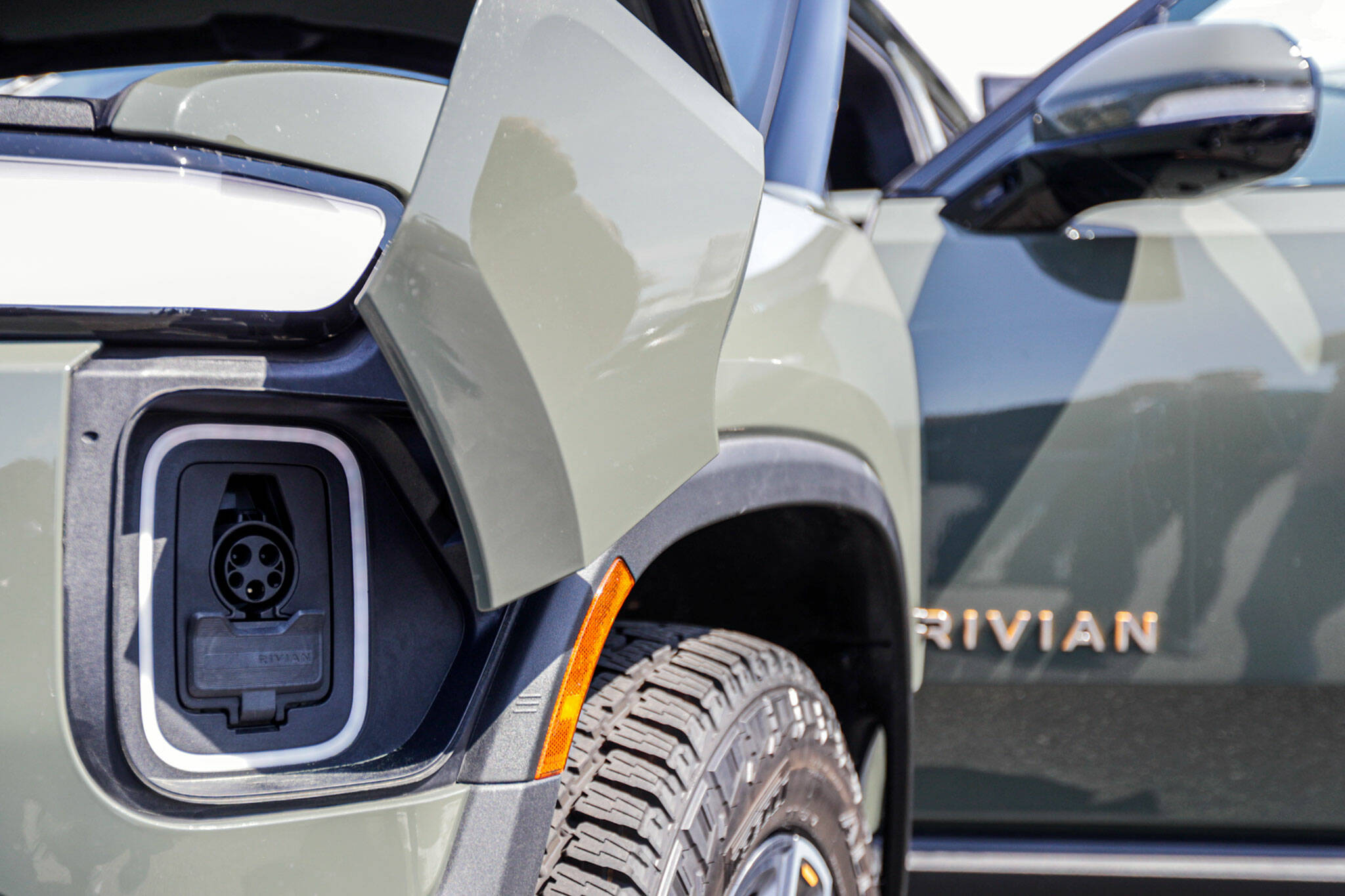 The charging port for a Rivian R1T Saturday afternoon during Drive Electric Earth Day in the Everett, Washington on April 23, 2022. (Kevin Clark / Sound Publishing)